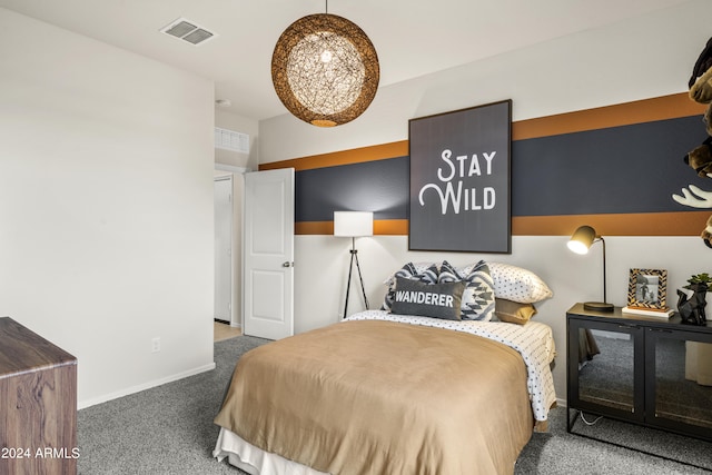 bedroom featuring carpet floors and baseboards