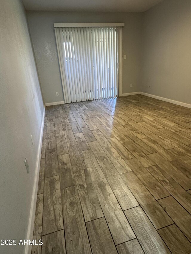8101 N 107th Ave Unit 26, Peoria, AZ 85345 - unfurnished room with wood-type flooring and baseboards