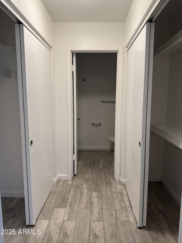 8101 N 107th Ave Unit 26, Peoria, AZ 85345 - corridor with light wood-style flooring and baseboards