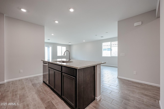 1917 S 246th Ln, Buckeye, AZ 85326 - kitchen featuring dishwasher, a wealth of natural light, light wood-style flooring, and a sink