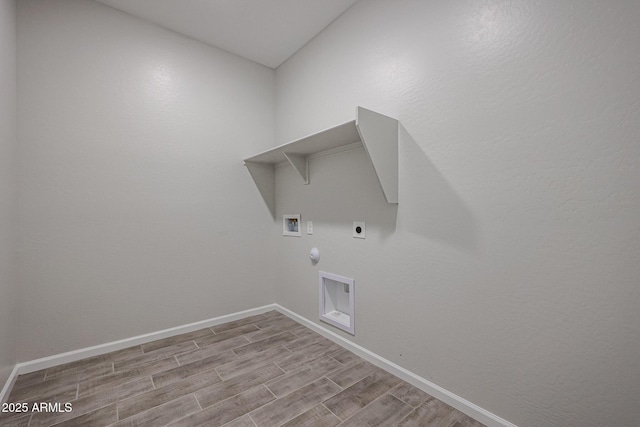 1917 S 246th Ln, Buckeye, AZ 85326 - clothes washing area with hookup for a washing machine, hookup for a gas dryer, wood finished floors, electric dryer hookup, and laundry area