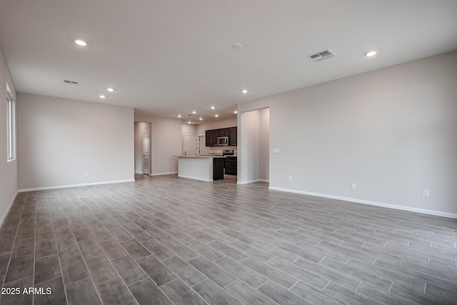 1917 S 246th Ln, Buckeye, AZ 85326 - unfurnished living room with recessed lighting, visible vents, and baseboards