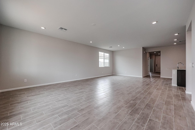 1917 S 246th Ln, Buckeye, AZ 85326 - unfurnished room with baseboards, light wood-type flooring, visible vents, and recessed lighting