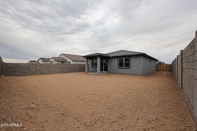 1917 S 246th Ln, Buckeye, AZ 85326 - rear view of property featuring a fenced backyard and stucco siding