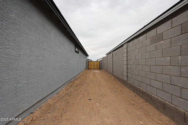 1917 S 246th Ln, Buckeye, AZ 85326 - view of side of home featuring fence and stucco siding