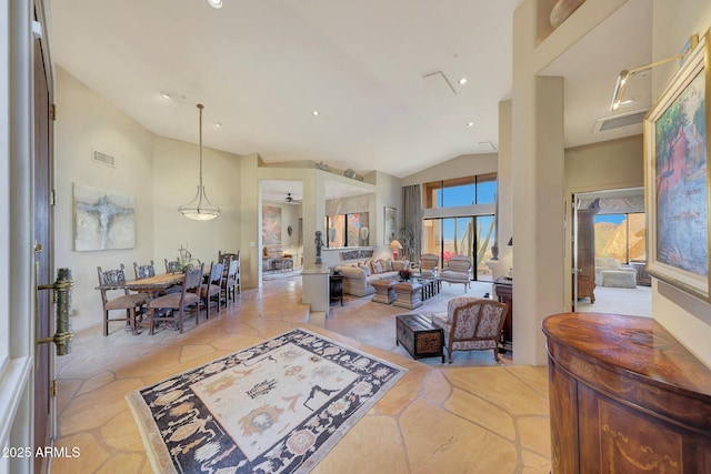 living room with vaulted ceiling and ceiling fan