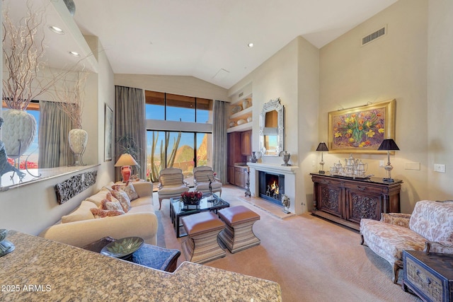 living room featuring light colored carpet and high vaulted ceiling