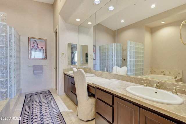 bathroom featuring tile patterned flooring, vanity, and independent shower and bath