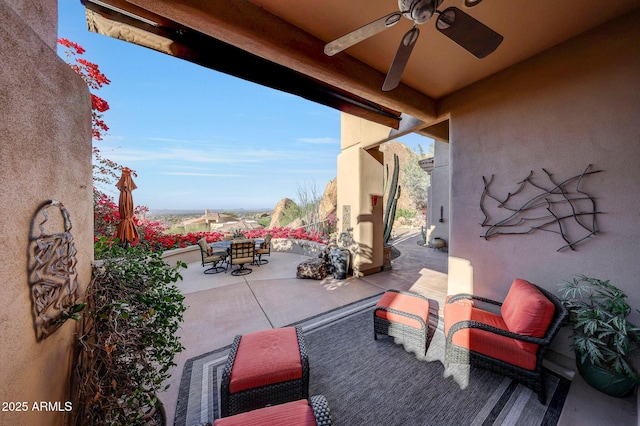 view of patio featuring ceiling fan