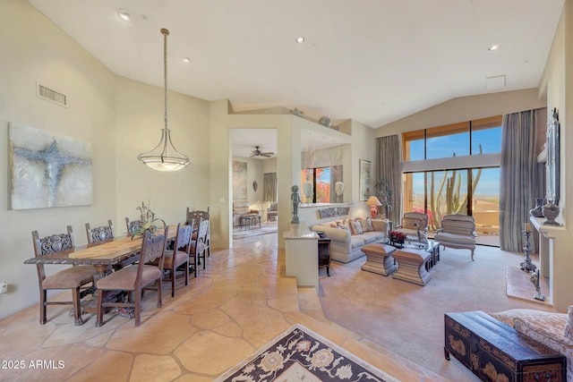 living room with ceiling fan and lofted ceiling