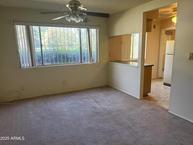 2530 W Berridge Ln Unit E111, Phoenix, AZ 85017 - spare room with ceiling fan, carpet flooring, and a textured ceiling