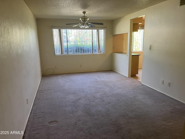 2530 W Berridge Ln Unit E111, Phoenix, AZ 85017 - carpeted spare room featuring ceiling fan, a textured ceiling, and baseboards