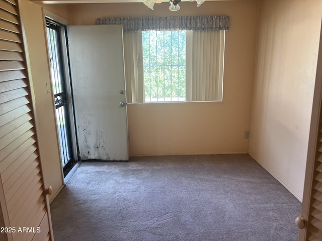 2530 W Berridge Ln Unit E111, Phoenix, AZ 85017 - unfurnished room with carpet floors and plenty of natural light