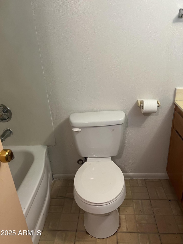 2530 W Berridge Ln Unit E111, Phoenix, AZ 85017 - bathroom featuring vanity, toilet, and baseboards
