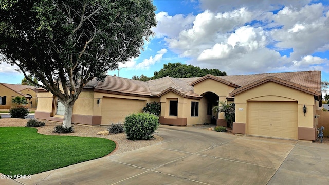 view of front of house with a garage and a front yard