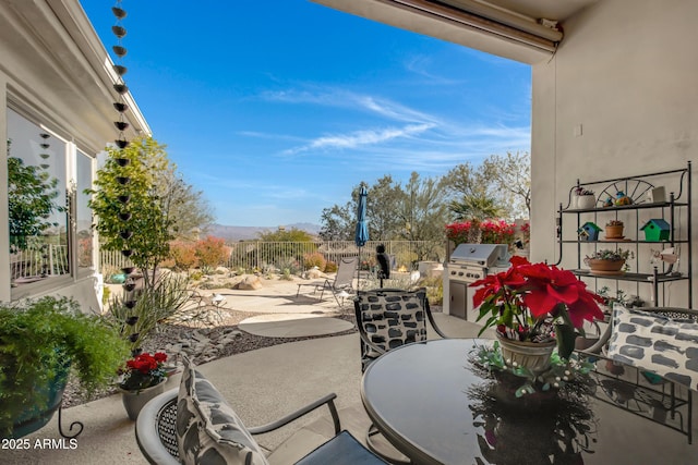 balcony featuring grilling area and a patio