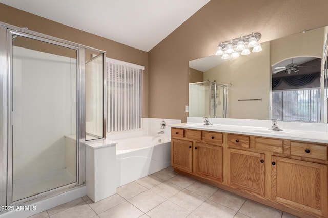 3871 E Ironhorse Rd, Gilbert, AZ 85297 - full bathroom with vaulted ceiling, a shower stall, ceiling fan, double vanity, and a garden tub