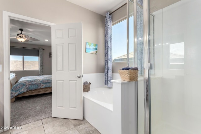 full bathroom with a stall shower, ceiling fan, ensuite bathroom, a garden tub, and tile patterned flooring