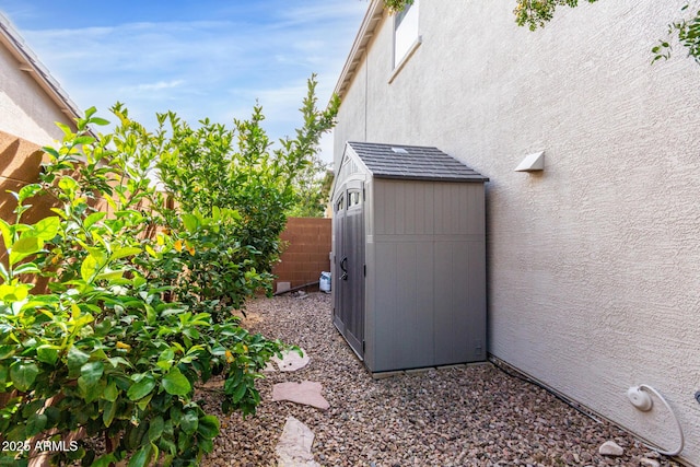 view of shed with fence