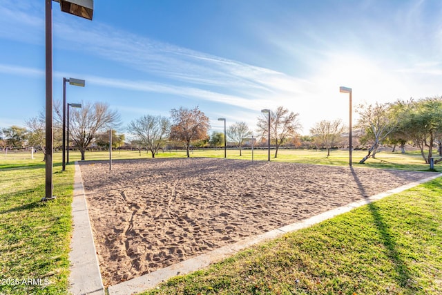 view of community featuring a yard and volleyball court