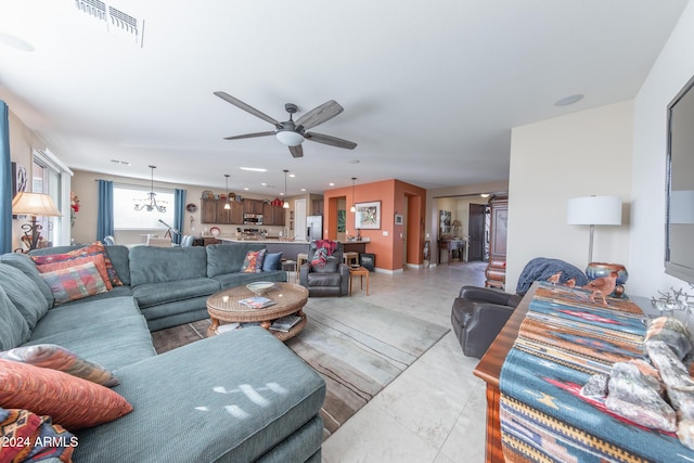 tiled living room featuring ceiling fan