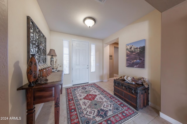 entrance foyer featuring light tile patterned floors