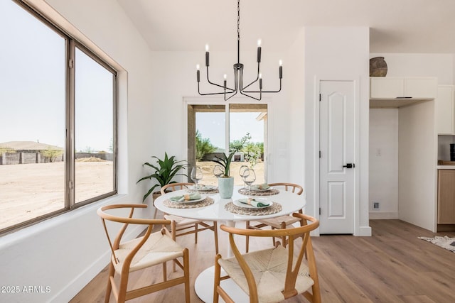 4561 E Red Bird Ln, San Tan Valley, AZ 85140 - dining area featuring light wood finished floors and a chandelier