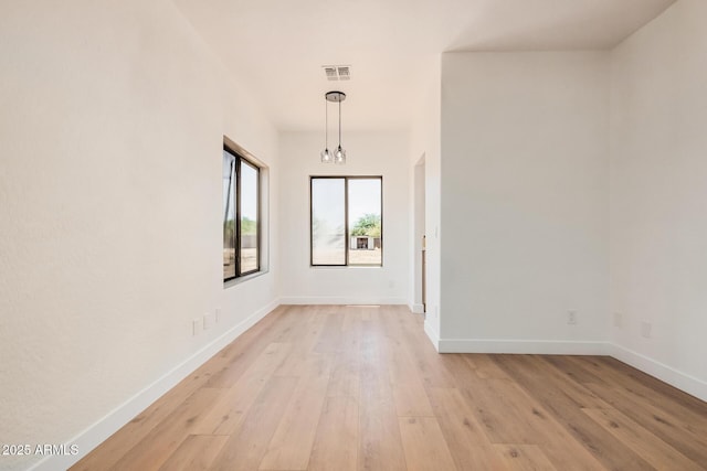 4561 E Red Bird Ln, San Tan Valley, AZ 85140 - empty room featuring light wood-style flooring and a chandelier