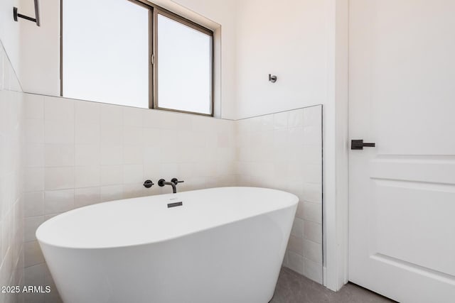 4561 E Red Bird Ln, San Tan Valley, AZ 85140 - bathroom featuring tile walls and a freestanding bath