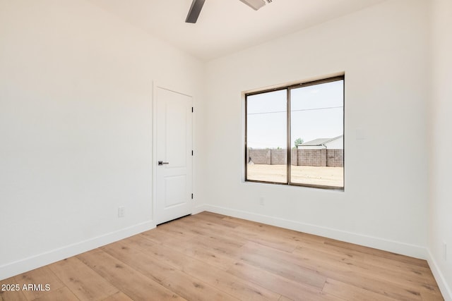 4561 E Red Bird Ln, San Tan Valley, AZ 85140 - empty room with light wood-style flooring and ceiling fan