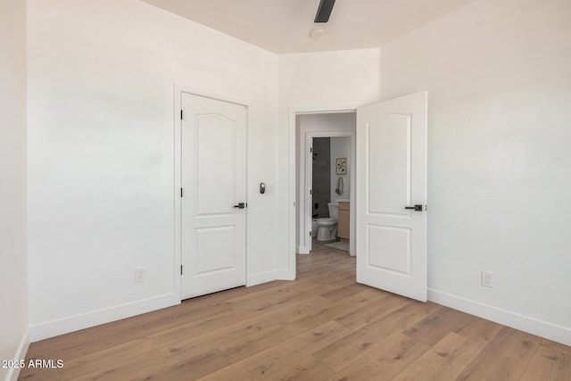 4561 E Red Bird Ln, San Tan Valley, AZ 85140 - unfurnished bedroom featuring baseboards and light wood finished floors