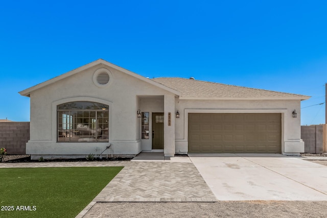 4561 E Red Bird Ln, San Tan Valley, AZ 85140 - view of front of home with a garage, concrete driveway, and stucco siding
