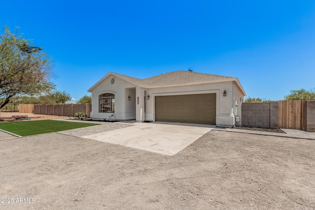 4561 E Red Bird Ln, San Tan Valley, AZ 85140 - single story home featuring concrete driveway, an attached garage, and stucco siding