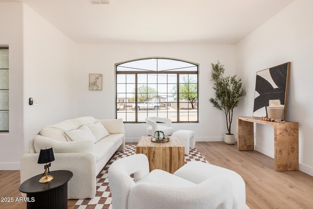 4561 E Red Bird Ln, San Tan Valley, AZ 85140 - living room featuring light wood-type flooring and baseboards