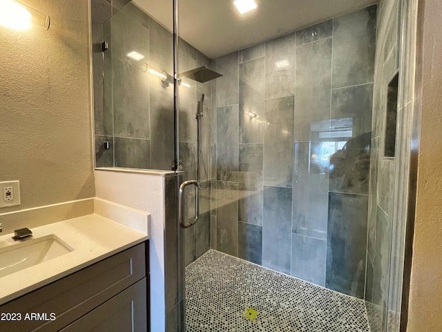 bathroom featuring vanity and walk in shower