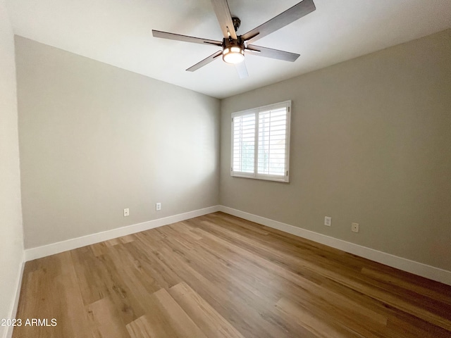 unfurnished room featuring hardwood / wood-style flooring and ceiling fan