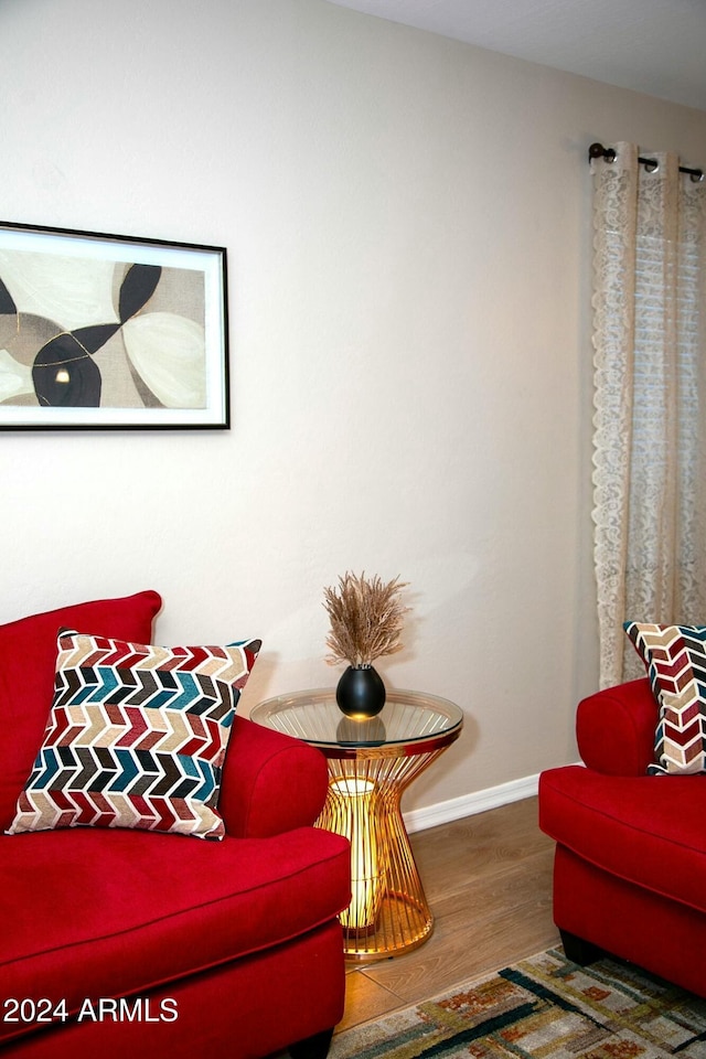 living area with hardwood / wood-style flooring