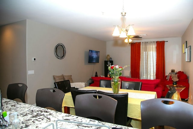 dining area with a notable chandelier