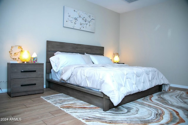 bedroom featuring light hardwood / wood-style floors