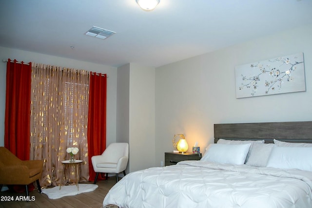 bedroom featuring wood-type flooring