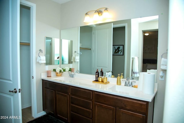 bathroom with vanity and hardwood / wood-style flooring