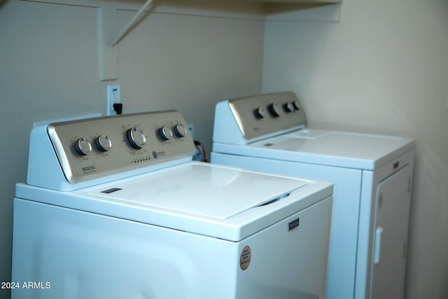 washroom featuring washer and clothes dryer