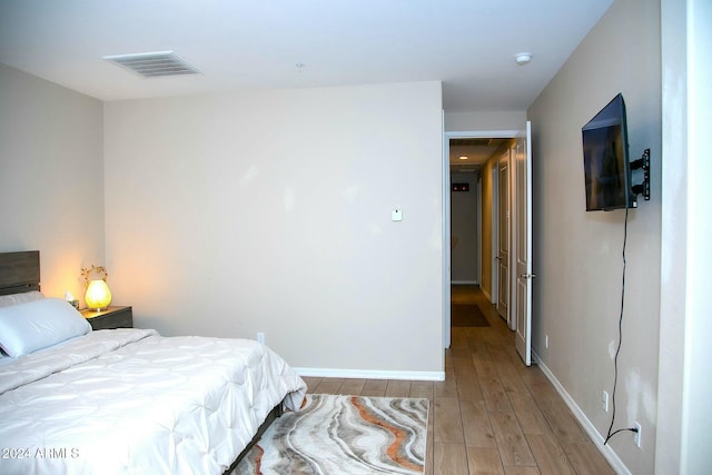 bedroom with light hardwood / wood-style flooring