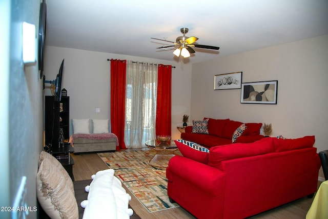 living room featuring ceiling fan and wood-type flooring