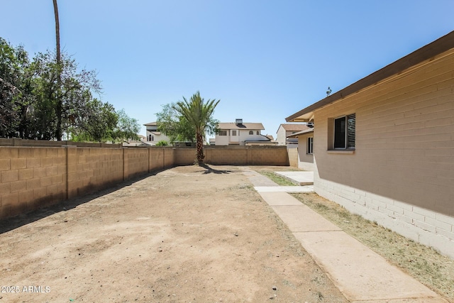 view of yard with a fenced backyard