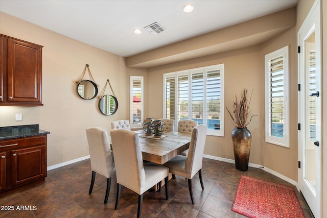 dining area featuring baseboards, dark tile patterned floors, recessed lighting, and visible vents