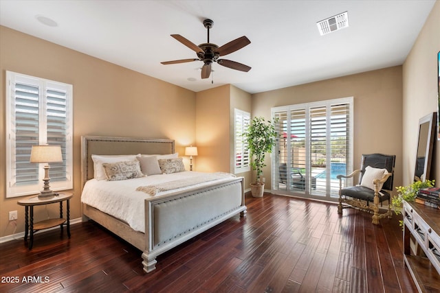 bedroom with access to outside, baseboards, visible vents, and dark wood-style floors