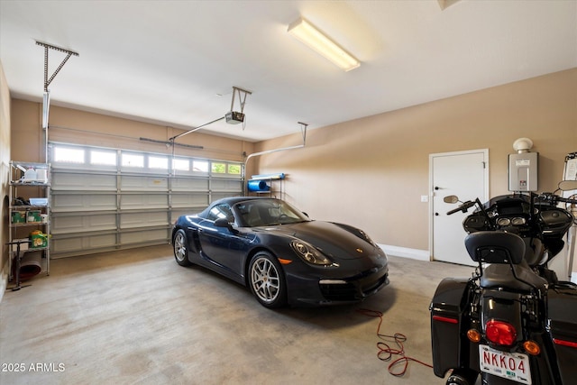 garage featuring baseboards and a garage door opener