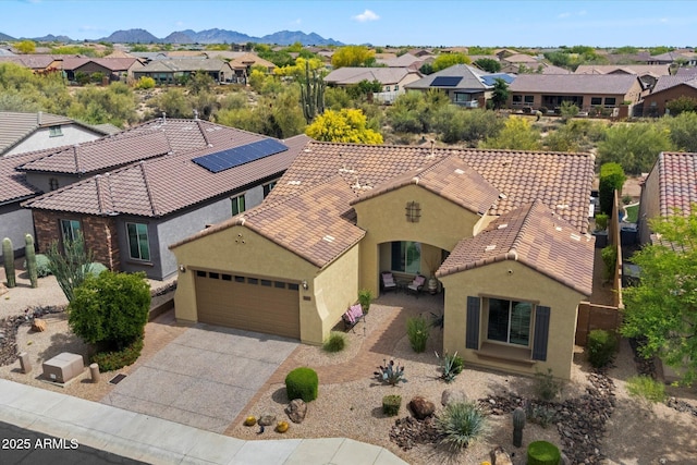 birds eye view of property with a residential view and a mountain view