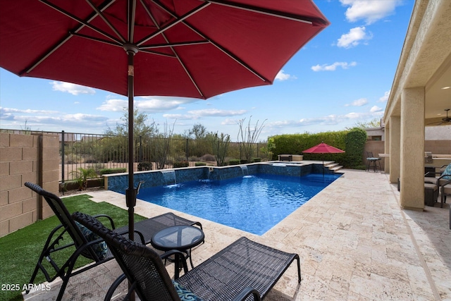 view of swimming pool with a patio, a pool with connected hot tub, a fenced backyard, and outdoor dining space